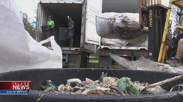 Volunteers sort through waves of marine debris collected from Hawaii's shores